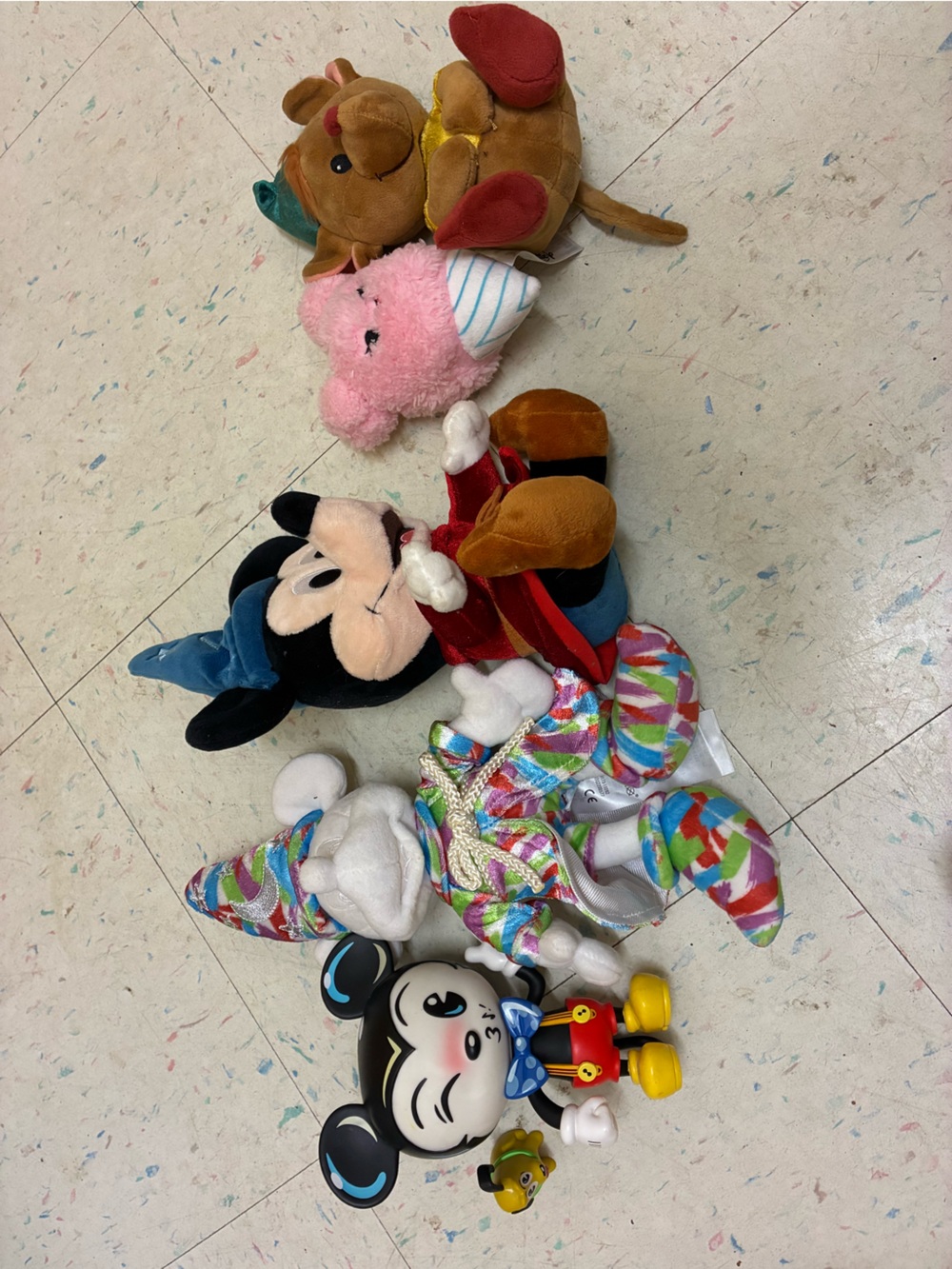 Assorted Disney plush and plastic toys